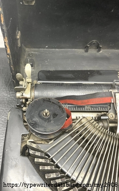 Left end of top.
