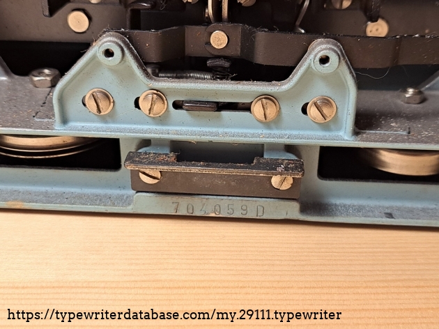 Serial number is on the bottom of the machine.