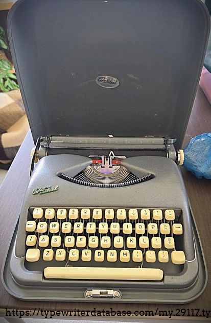 Front main view with machine in case.