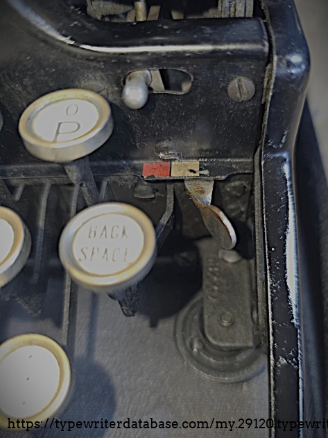Top-right of keyboard area, showing serial number location.