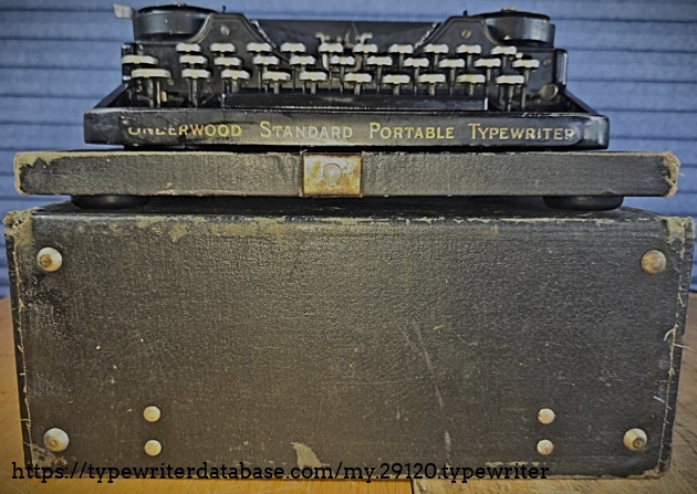 Typewriter on top of case.