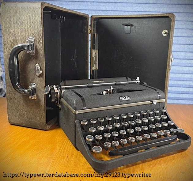 Forward left, in front of case.