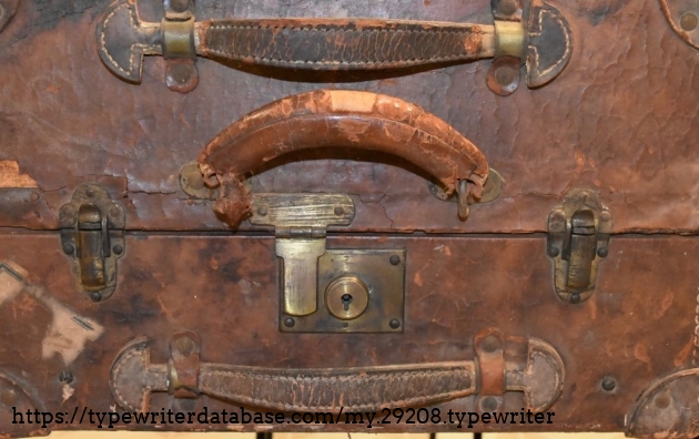 Three latches and three handles, with leather corner reinforcements.  This must have been an expensive case.