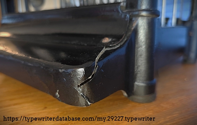 Left rear quadrant close-up, showing frame crack.