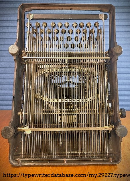 Underside, showing crack-through of frame at rear left.