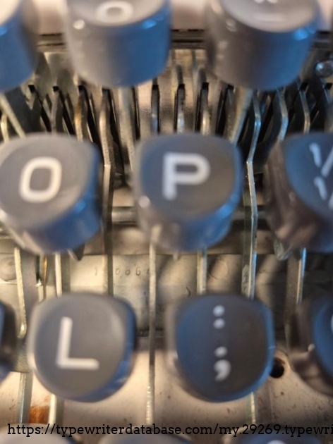 Serial number is hidden under the keys.