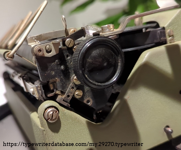 Left side view. you can see the missing screwhole for the missing part, presumably the carriage lock.