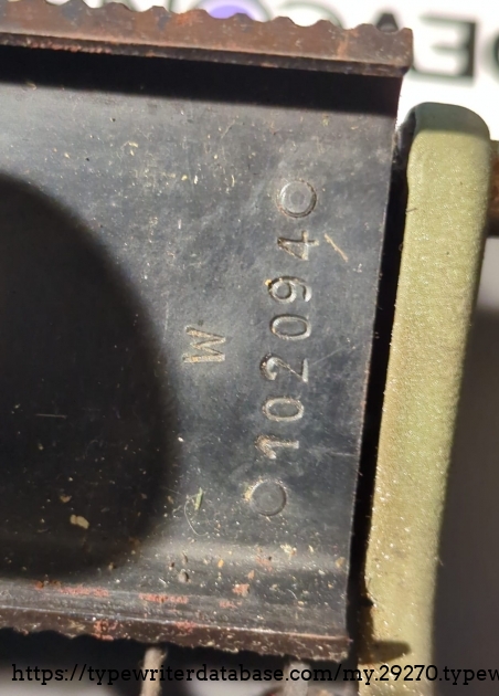 The serial number, on the right belhind the carriage. "102094" with a" W" above it, which isnt mentioned in any serial number lists...