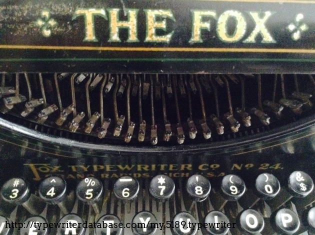 Words "Fox Typewriter Co. No. 24" located behind keyboard.