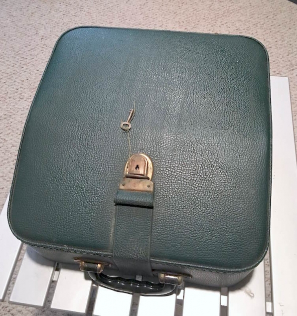 The green leather case has a key!