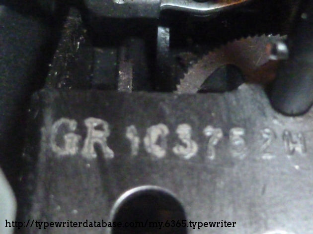 Serial number located under the left ribbon spool