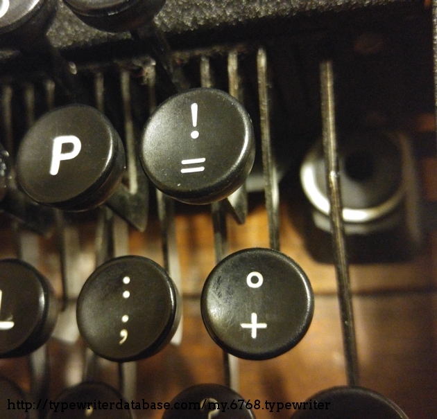 While this "budget" model lacks bichrome ribbon, an adjustable right margin, tab stops, and other extras, it does have a few math keys that I wish I had on my other typewriters from this era. I suppose this was marketed to students.