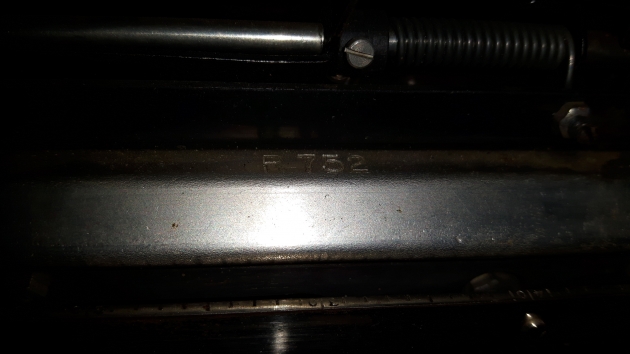 Serial number found, on the unpainted steel on the back left side of the carriage, on the horizontal lip.
