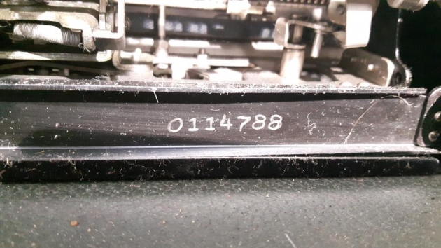 The serial number is on the underside of the machine.