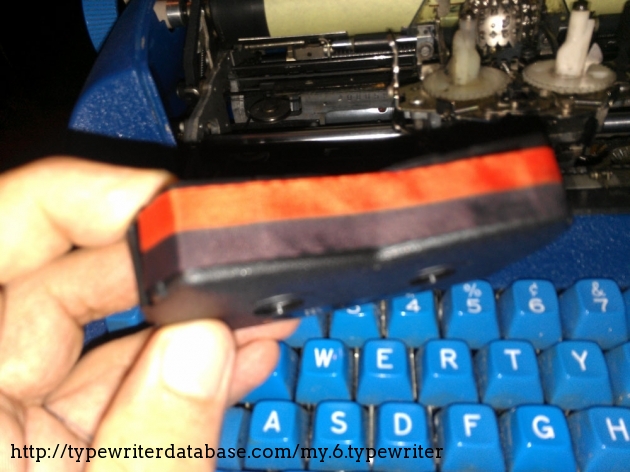 A 2-color Selectric ribbon? yes, and it works! The Model 72's, unlike the later Selectric II/III does not automatically move the ribbon up and down with each keystroke to cover the entire face of the ribbon. Instead, it has a 4-position selector lever hidden underneath the ball carrier. (top/middle/bottom/stencil)