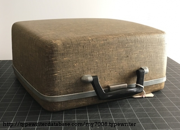 The case appears to be reinforced with resin/fiberglass cloth, almost like Samsonite luggage from the era.