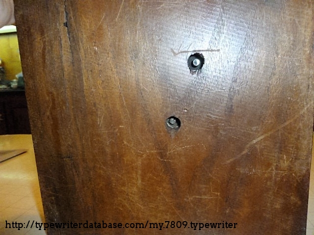 the holes underneath the wooden base are neccesary in order to operate the typewriter