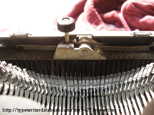 Typebasket with strange touch control mechanism and a run-of-the-mill serif typeface.