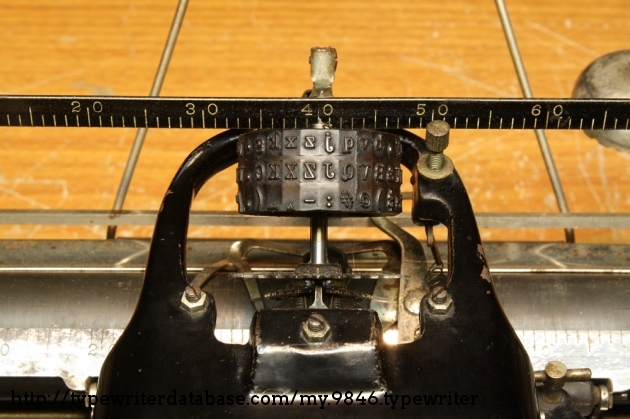 Similarly, pressing the FIG button raises the type cylinder up to the second level so the top row of characters will strike the platen.
