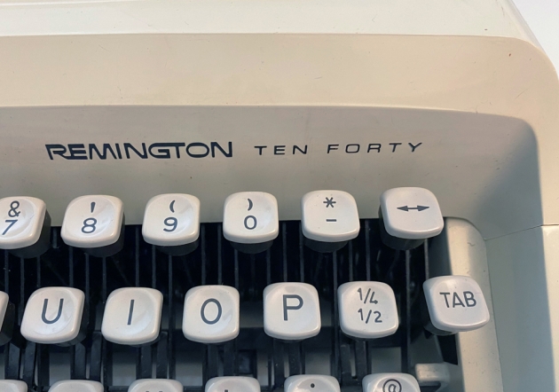 Remington "Ten Forty" from the maker/model logo on the front....