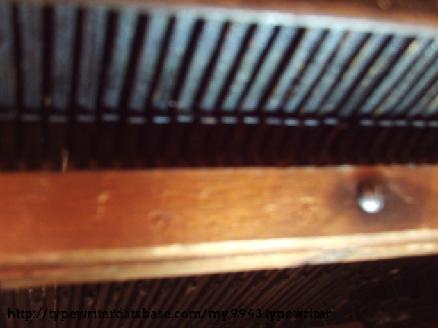 Under the typewriter, on the back-side in the wood, Remington also stamps the serial number; matching the one stamped into the metal case body.